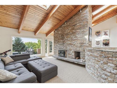 39 Anatapi Lane Sw, Calgary, AB - Indoor Photo Showing Living Room With Fireplace