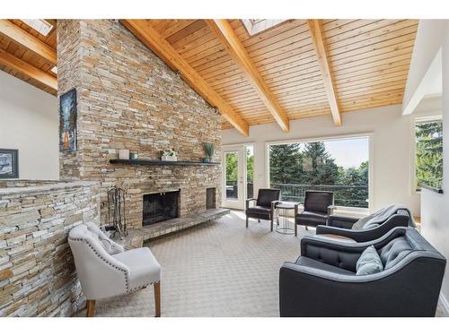 39 Anatapi Lane Sw, Calgary, AB - Indoor Photo Showing Living Room With Fireplace