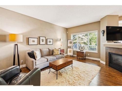 515 Sierra Morena Place Sw, Calgary, AB - Indoor Photo Showing Living Room With Fireplace