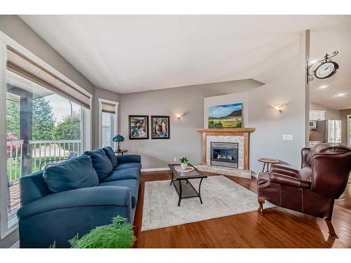 526 Carriage Lane Drive, Carstairs, AB - Indoor Photo Showing Living Room With Fireplace