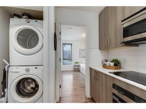 101-1629 38 Street Sw, Calgary, AB - Indoor Photo Showing Laundry Room