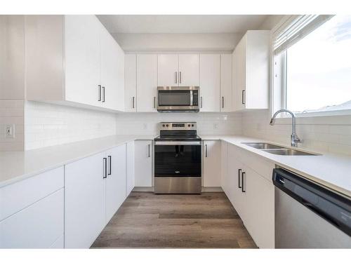 508-16 Evanscrest Park Nw, Calgary, AB - Indoor Photo Showing Kitchen With Double Sink