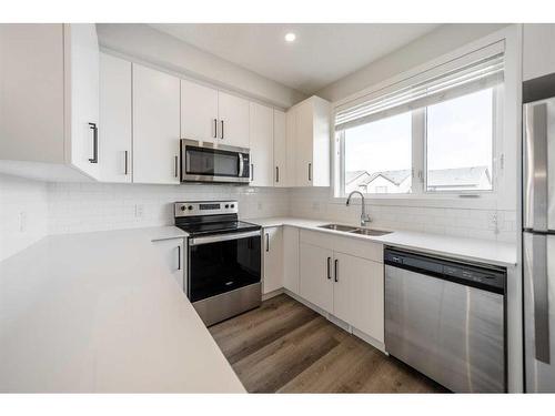 508-16 Evanscrest Park Nw, Calgary, AB - Indoor Photo Showing Kitchen With Double Sink