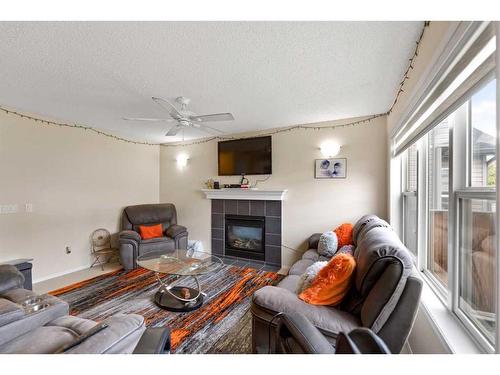 51 Saddlecrest Gardens Ne, Calgary, AB - Indoor Photo Showing Living Room With Fireplace