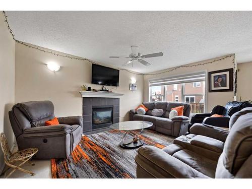 51 Saddlecrest Gardens Ne, Calgary, AB - Indoor Photo Showing Living Room With Fireplace