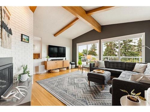 80 Cromwell Avenue Nw, Calgary, AB - Indoor Photo Showing Living Room With Fireplace