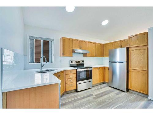 7746 Laguna Way Ne, Calgary, AB - Indoor Photo Showing Kitchen With Stainless Steel Kitchen With Double Sink