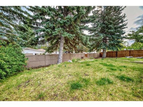 9616 Palisan Place Sw, Calgary, AB - Outdoor With Backyard