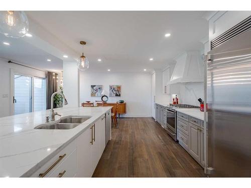 8 Coach Manor Rise Sw, Calgary, AB - Indoor Photo Showing Kitchen With Double Sink With Upgraded Kitchen