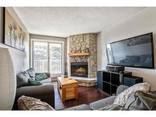 404-1919 17 Avenue Sw, Calgary, AB - Indoor Photo Showing Living Room With Fireplace