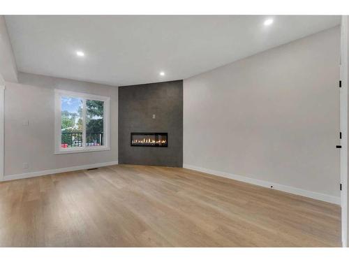 1327B 35 Street Se, Calgary, AB - Indoor Photo Showing Other Room With Fireplace