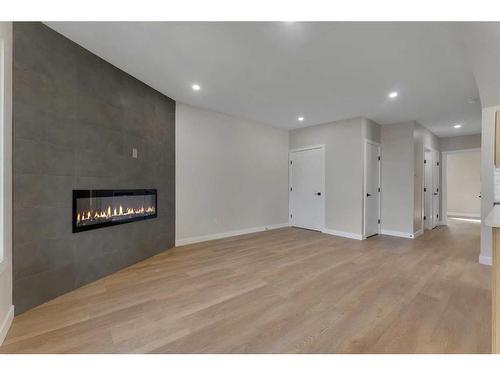 1327B 35 Street Se, Calgary, AB - Indoor With Fireplace