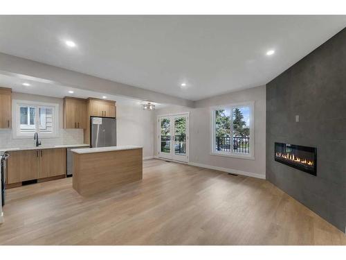 1327B 35 Street Se, Calgary, AB - Indoor With Fireplace