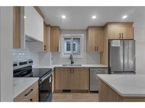 1327B 35 Street Se, Calgary, AB - Indoor Photo Showing Kitchen With Double Sink With Upgraded Kitchen