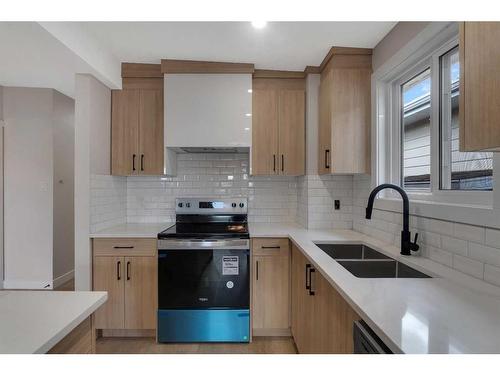 1327B 35 Street Se, Calgary, AB - Indoor Photo Showing Kitchen With Double Sink With Upgraded Kitchen