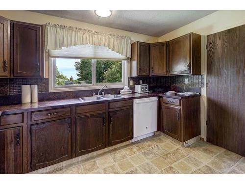 6 Radcliffe Crescent Se, Calgary, AB - Indoor Photo Showing Kitchen With Double Sink