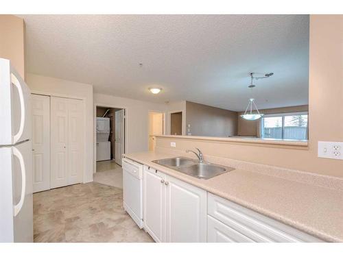 4111-4975 130 Avenue Se, Calgary, AB - Indoor Photo Showing Kitchen With Double Sink