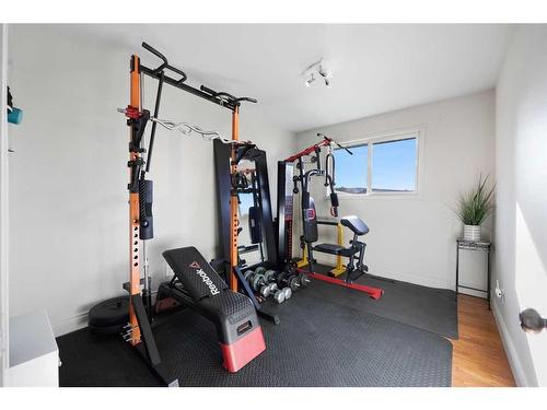 12 Harmon Place Sw, Calgary, AB - Indoor Photo Showing Gym Room