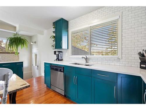 12 Harmon Place Sw, Calgary, AB - Indoor Photo Showing Kitchen With Double Sink