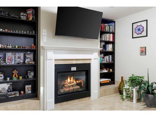 12 Harmon Place Sw, Calgary, AB - Indoor With Fireplace