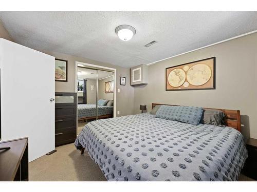 12 Harmon Place Sw, Calgary, AB - Indoor Photo Showing Bedroom