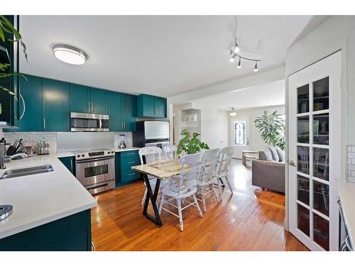 12 Harmon Place Sw, Calgary, AB - Indoor Photo Showing Kitchen With Double Sink