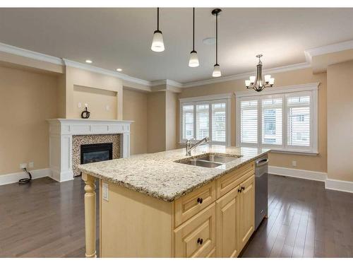 1-420 8 Street Nw, Calgary, AB - Indoor Photo Showing Kitchen With Fireplace With Double Sink