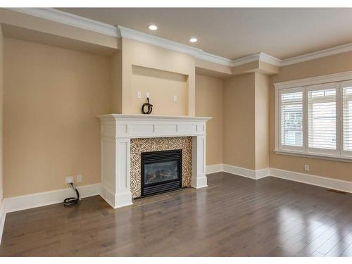 1-420 8 Street Nw, Calgary, AB - Indoor Photo Showing Living Room With Fireplace