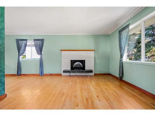 10727 Mapleshire Crescent Se, Calgary, AB - Indoor Photo Showing Living Room With Fireplace