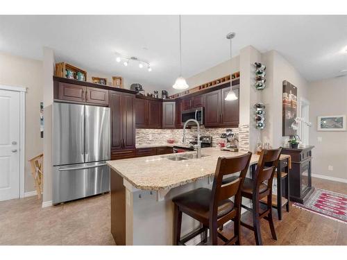 3112-4 Kingsland Close Se, Airdrie, AB - Indoor Photo Showing Kitchen With Stainless Steel Kitchen With Upgraded Kitchen