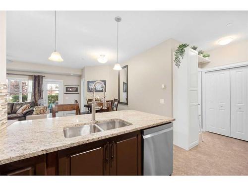 3112-4 Kingsland Close Se, Airdrie, AB - Indoor Photo Showing Kitchen With Double Sink