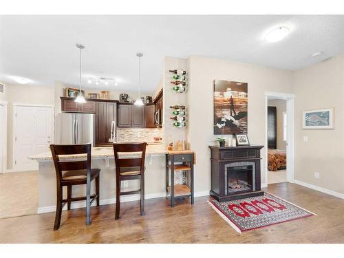 3112-4 Kingsland Close Se, Airdrie, AB - Indoor Photo Showing Living Room With Fireplace