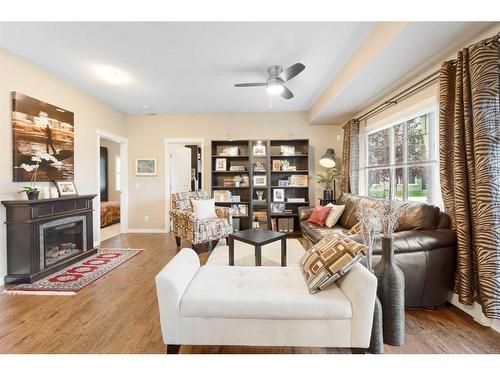 3112-4 Kingsland Close Se, Airdrie, AB - Indoor Photo Showing Living Room With Fireplace