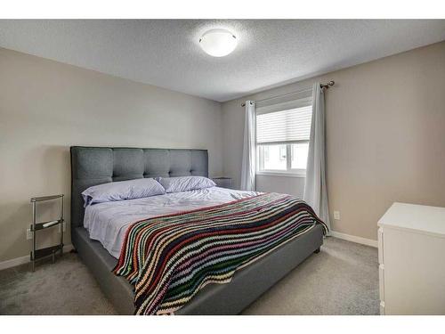 207 New Brighton Walk Se, Calgary, AB - Indoor Photo Showing Bedroom