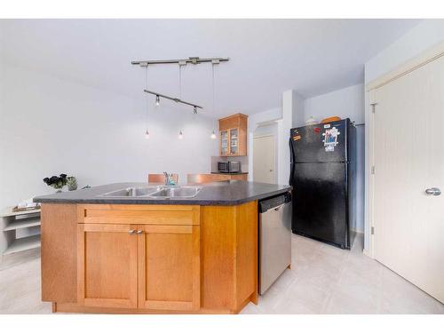 18 Valley Crest Close Nw, Calgary, AB - Indoor Photo Showing Kitchen With Double Sink