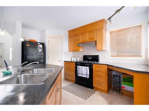 18 Valley Crest Close Nw, Calgary, AB - Indoor Photo Showing Kitchen With Double Sink