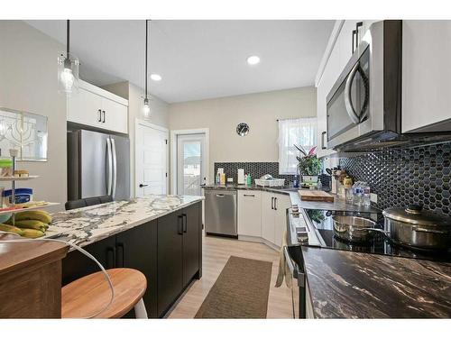 11 Ian Way, Sylvan Lake, AB - Indoor Photo Showing Kitchen With Stainless Steel Kitchen With Upgraded Kitchen