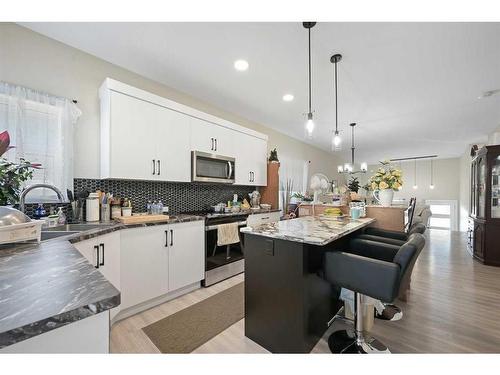 11 Ian Way, Sylvan Lake, AB - Indoor Photo Showing Kitchen With Stainless Steel Kitchen With Upgraded Kitchen