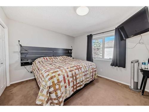 134 Bow Ridge Court, Cochrane, AB - Indoor Photo Showing Bedroom