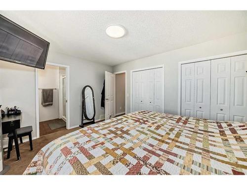 134 Bow Ridge Court, Cochrane, AB - Indoor Photo Showing Bedroom