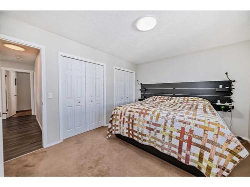 134 Bow Ridge Court, Cochrane, AB - Indoor Photo Showing Bedroom