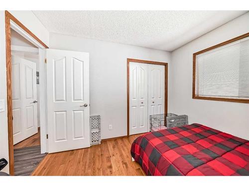 134 Bow Ridge Court, Cochrane, AB - Indoor Photo Showing Bedroom