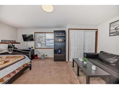 134 Bow Ridge Court, Cochrane, AB - Indoor Photo Showing Bedroom