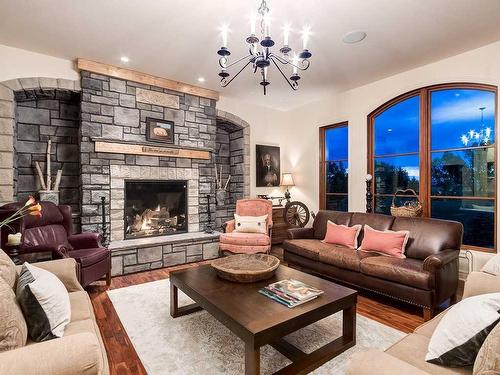 242245 Chinook Arch Lane, Rural Rocky View County, AB - Indoor Photo Showing Living Room With Fireplace