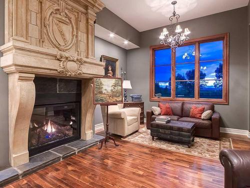 242245 Chinook Arch Lane, Rural Rocky View County, AB - Indoor Photo Showing Living Room With Fireplace