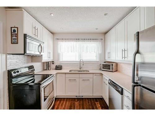 3911 Centre A Street Ne, Calgary, AB - Indoor Photo Showing Kitchen With Stainless Steel Kitchen With Double Sink