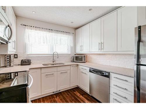 3911 Centre A Street Ne, Calgary, AB - Indoor Photo Showing Kitchen With Stainless Steel Kitchen With Double Sink