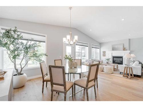 32 Walden Place Se, Calgary, AB - Indoor Photo Showing Dining Room With Fireplace