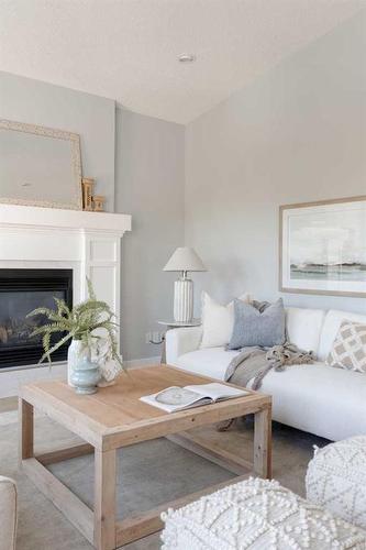 32 Walden Place Se, Calgary, AB - Indoor Photo Showing Living Room With Fireplace