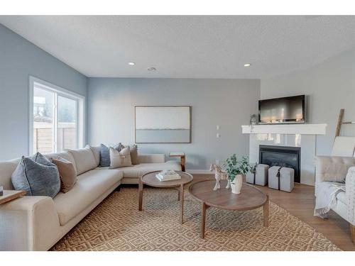 32 Walden Place Se, Calgary, AB - Indoor Photo Showing Living Room With Fireplace